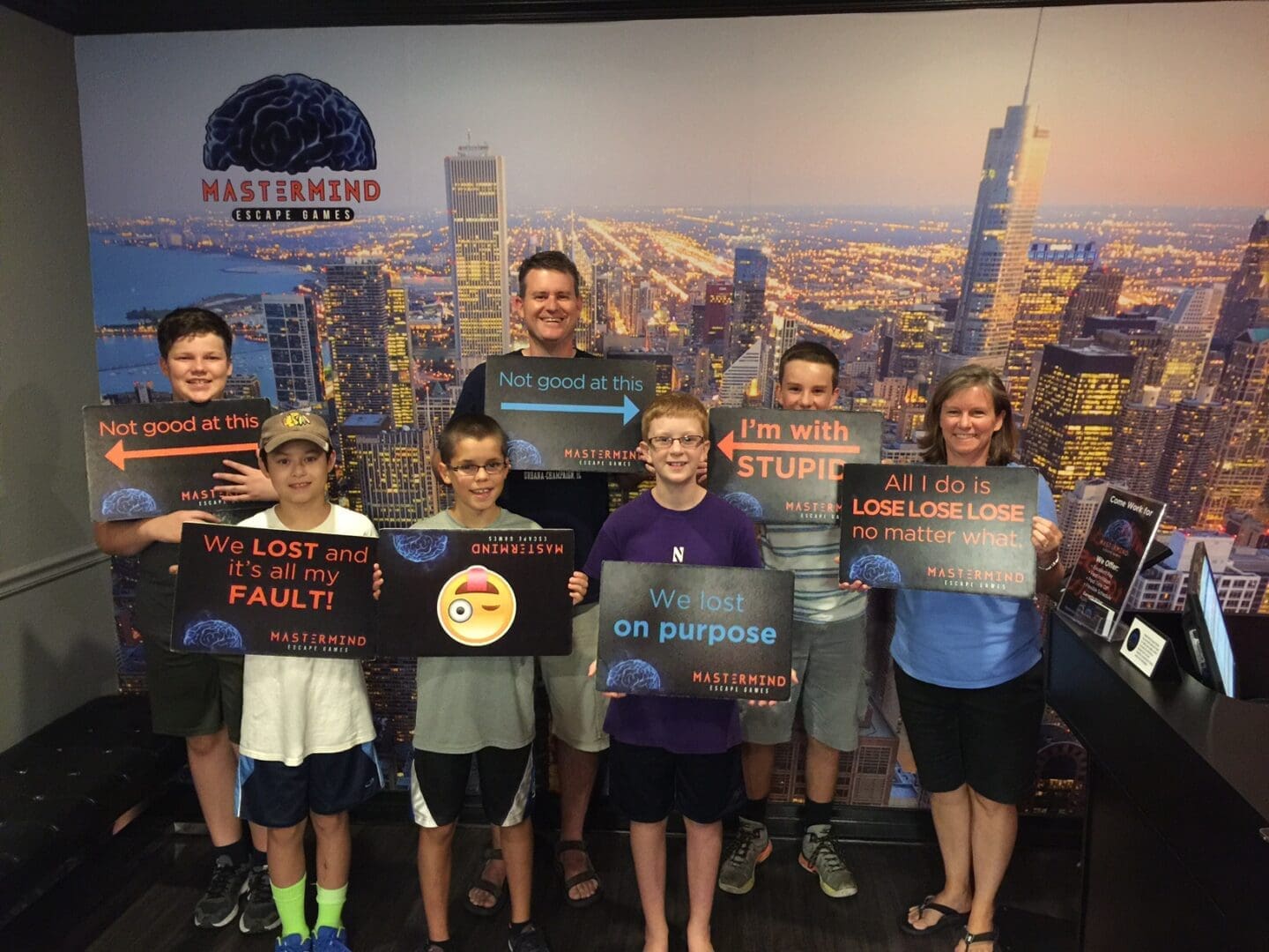 A group of people holding signs in front of a city.