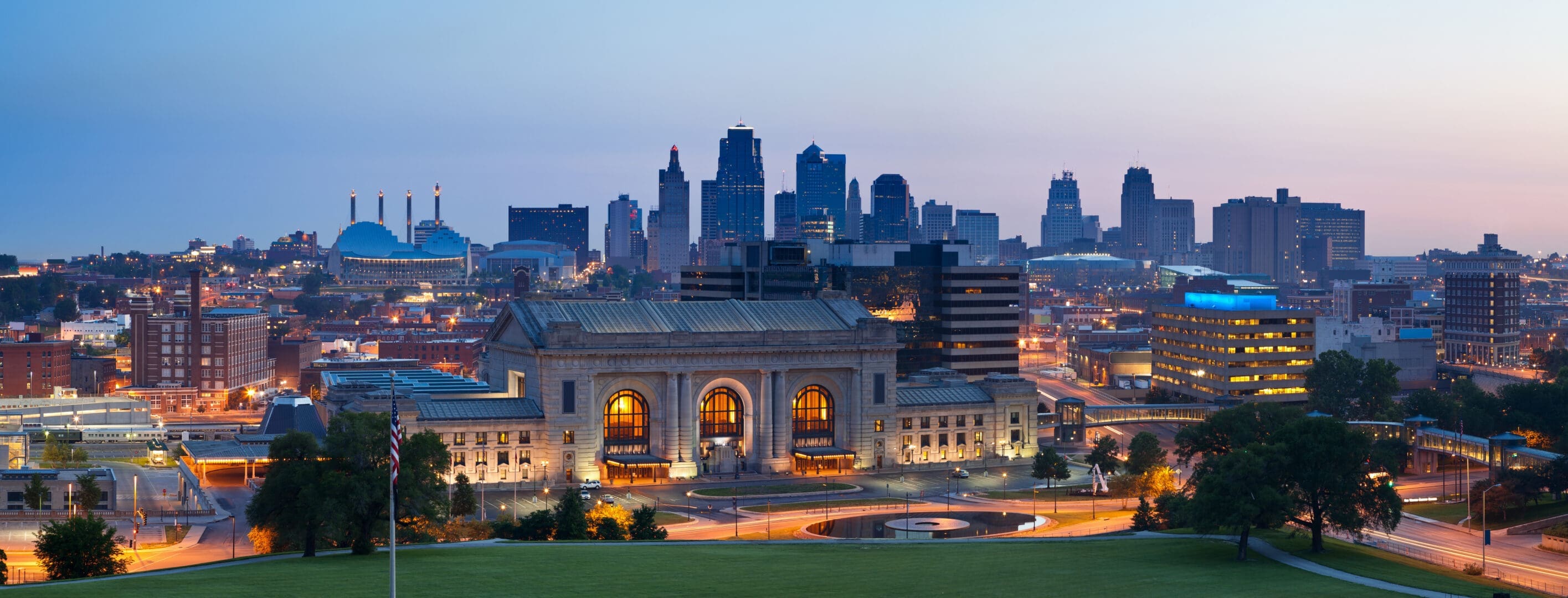A view of the kansas city skyline at dusk.